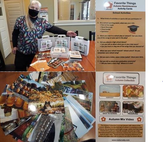 Woman Librarian standing by a display of plastic containers, photo cards, and a DVD case